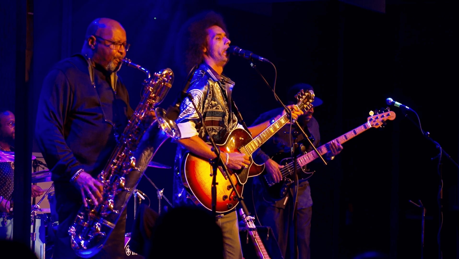 Band playing sax and guitar